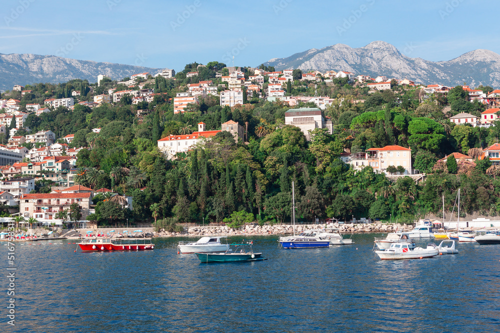 Coastal landscape with beach and harbor in Montenegro . Summer vacation in Herceg Novi Coastal landscape with beach and harbor in Montenegro . Summer vacation in Herceg Novi