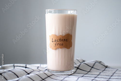 A glass of almond milk labeled Lactose Free