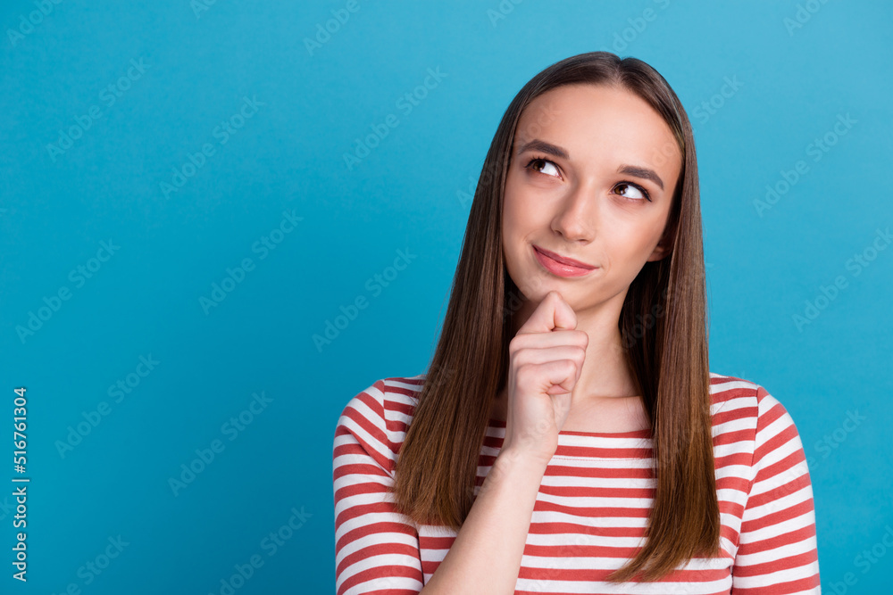 Photo of amazing lady looking up empty space deep thinking creative person isolated blue color background Photo of amazing lady looking up empty space deep thinking creative person isolated blue color background