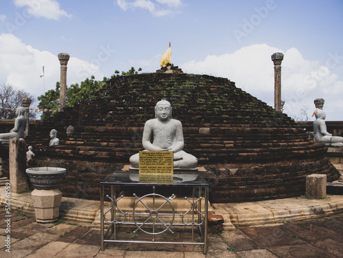Ruins of Girihandu Seya pagoda building. Translation: 1st paragraph : Buddhist sermon to worship the temple. Second paragraph " Offering by Mr. P.M.A Kandegedara  Mrs. Indrani Kandegedara."