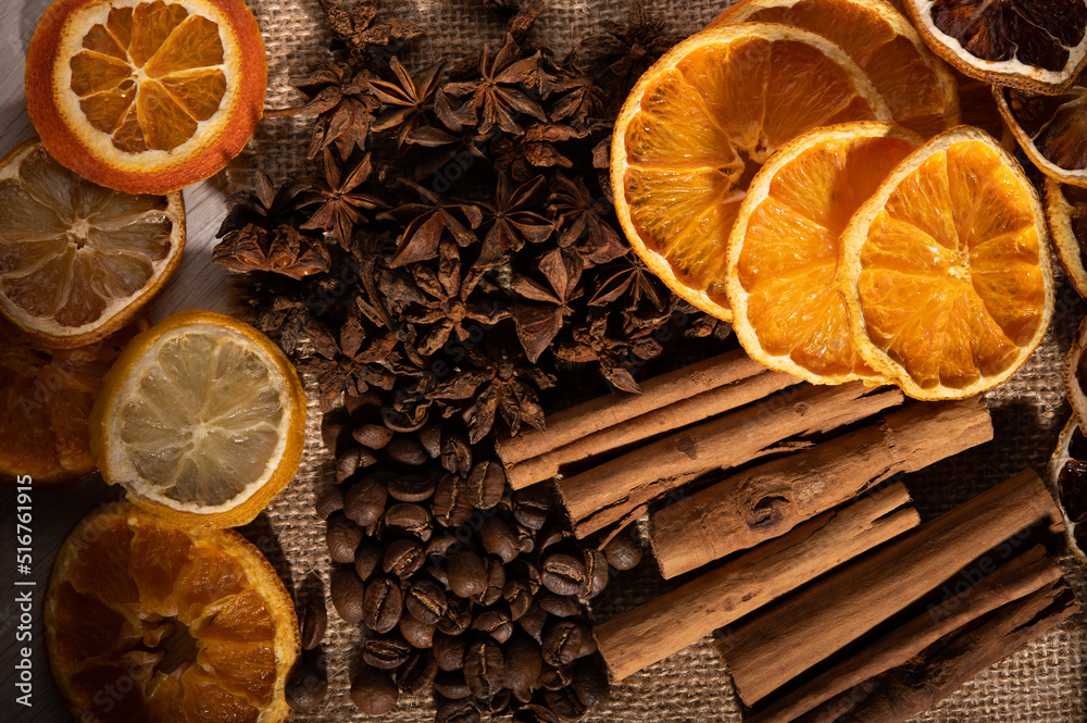Citrus fruit, cinnamon, star anise 
and coffee beans up close from above