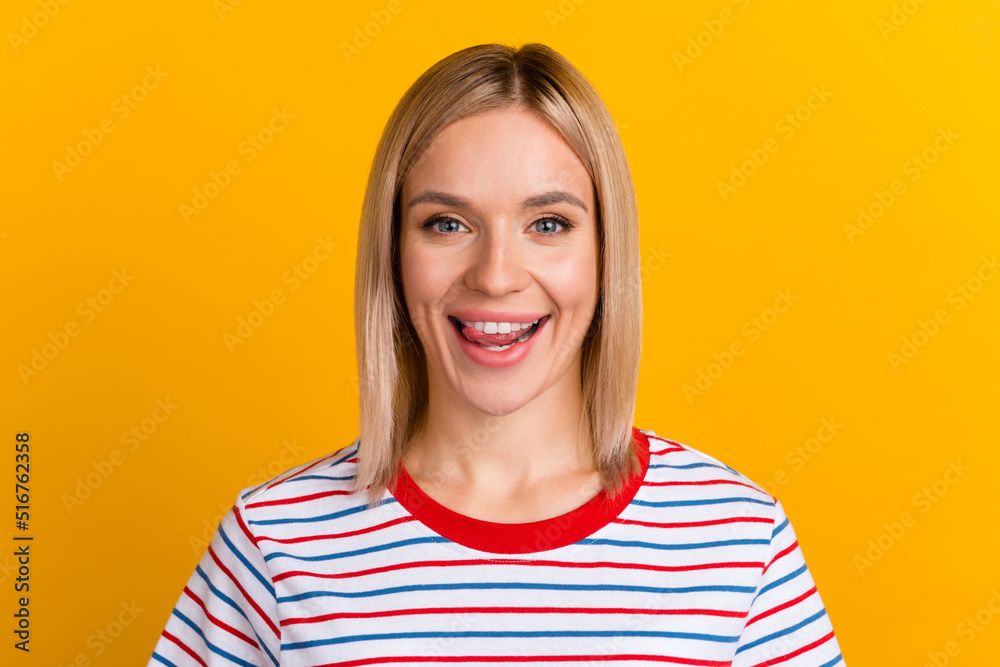 Photo of young beautiful playful girl show tongue lick lips dreamy isolated over yellow color background Photo of young beautiful playful girl show tongue lick lips dreamy isolated over yellow color background
