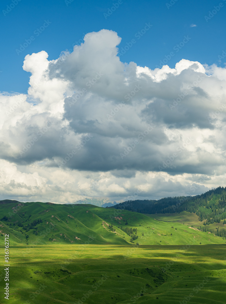 heavy clouds shadow on green plain and mountains heavy clouds shadow on green plain and mountains