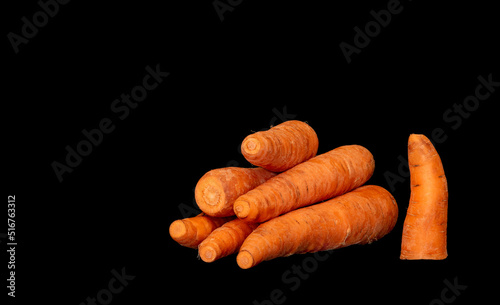 ripe vegetable root vegetable carrot on black background photo