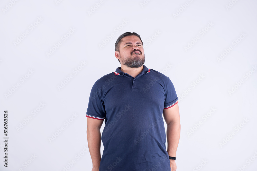 A stout man tightens his body trying not to fat. Looking funny and feeling  embarrassed. Isolated on a white background foto de Stock | Adobe Stock
