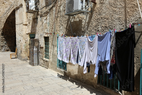 Laundry drying on the street in a big city © shimon