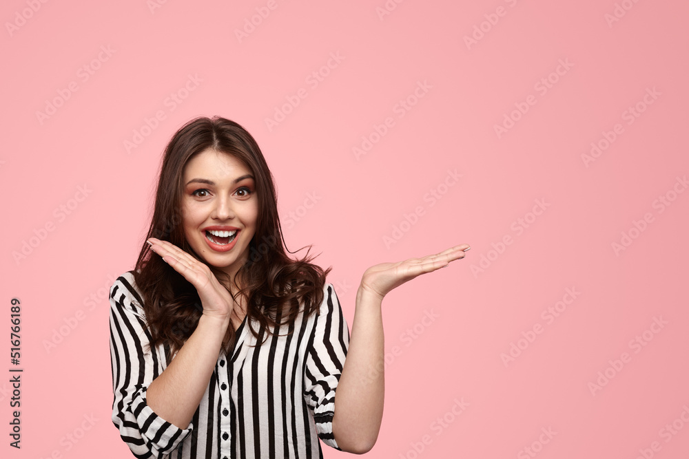 Excited woman showing empty space