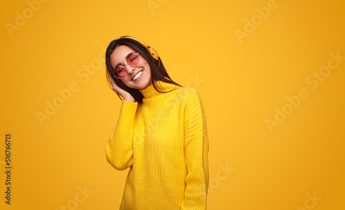 Happy woman listening to music © kegfire