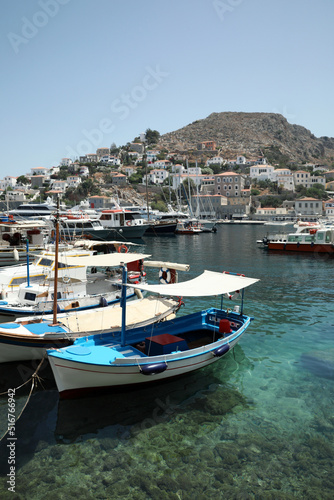 Beautiful view of coastal city with different boats on sunny day