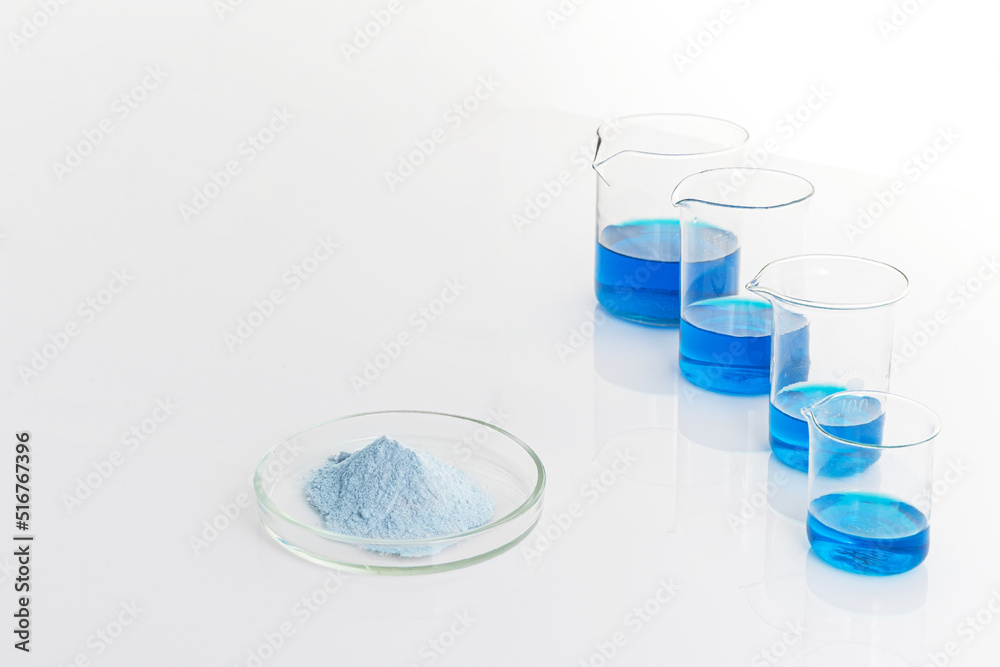 Biological active additive on a white background. Powder dissolved in water