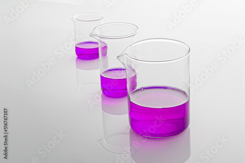 Purple solution in laboratory flasks