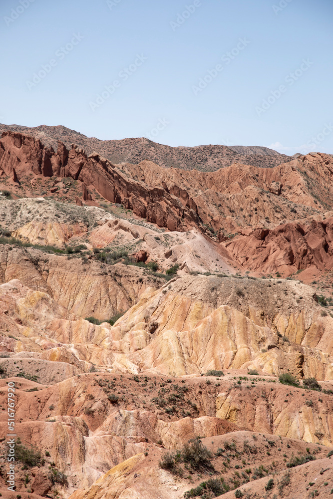 View of the dry desert badlands of Fairy Tale Canyon in Kyrgyzstan.