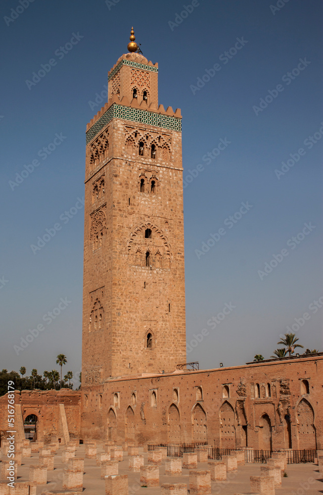 Koutoubia Mosque is the largest mosque in Marrakesh, Morocco, Africa. Located in the Jewish quarter, in the old Medina. The minaret tower is ornamented with curved windows, a band of ceramic inlay.