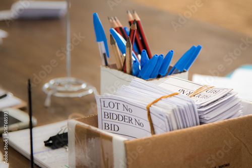 Bidding cards and pens at an auction