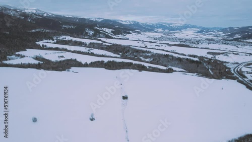 Snow-capped Mountains, Terrain And Houses During Wintertime In The Village Of Bacúch, Banská Bystrica Region Of Slovakia. Wide Drone Shot photo