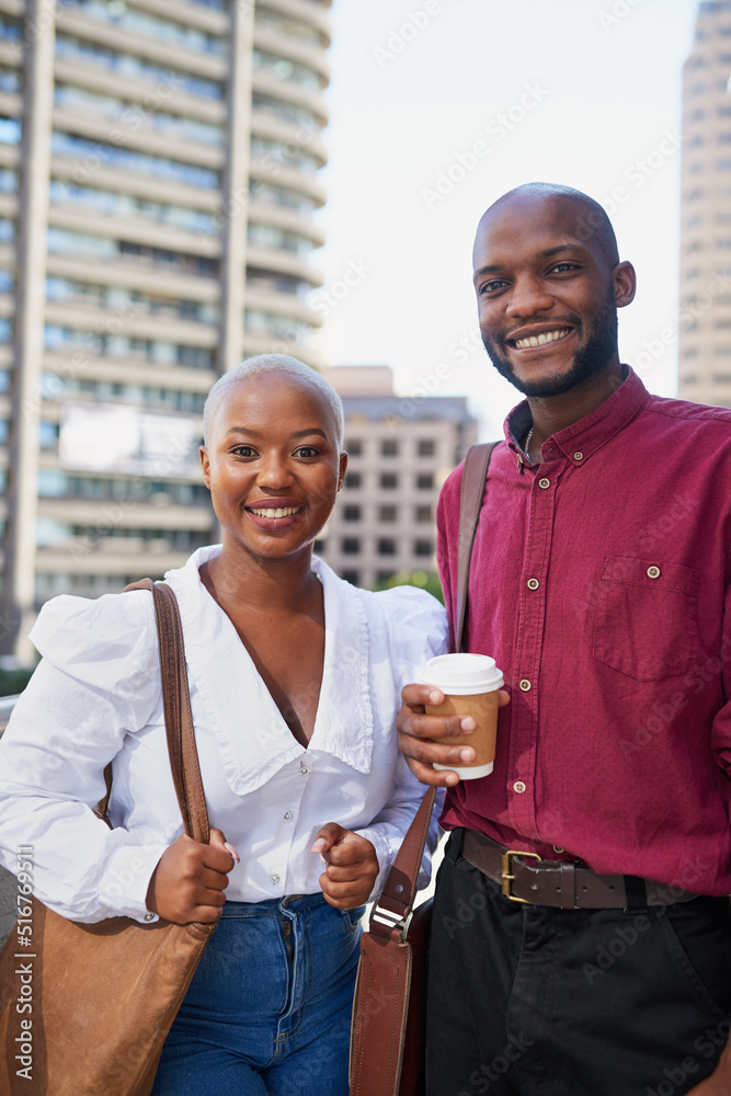 Two Black colleagues arrive at the office in the city for work Two Black colleagues arrive at the office in the city for work