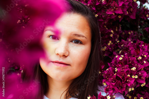 young pretty brunette girl surrounded by purple flowers, lifstyle people touristic season © iordani