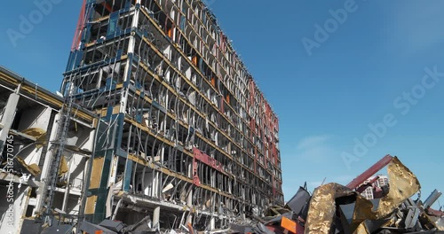 After bombing. War in Ukraine.Russia - terrorist country, destroyed shopping and entertainment center and killed people in Kyiv city on March 2022. Terror and genocide of Ukrainian people photo