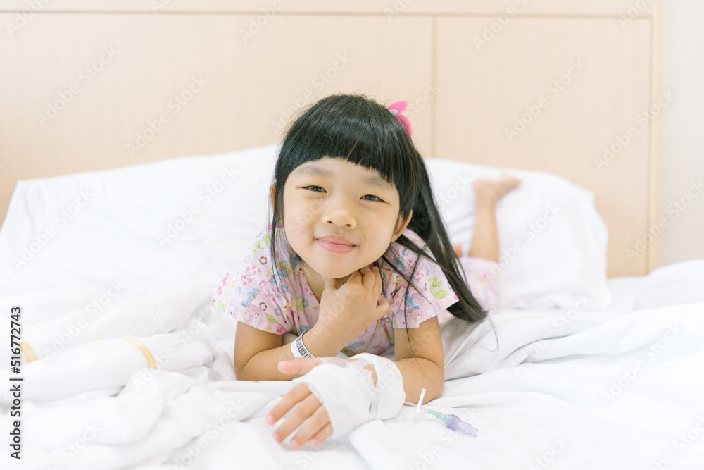 Asian child smile and admitted in hospital with saline intravenous on hand
Asian child smile and admitted in hospital with saline intravenous on hand