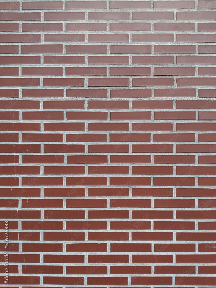 Background de pared de ladrillos rojos todos iguales, pura simetría y estructura arquitectónica rojiza Background de pared de ladrillos rojos todos iguales, pura simetría y estructura arquitectónica rojiza