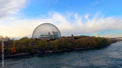 Biosphere of Montreal at Park Jean Drapeau Montreal Canada, Environment Museum, Hard Steel Truss Architectural Structure-Dome next to River, Beautiful Sunset Landscape view, blue cloudy sky photo