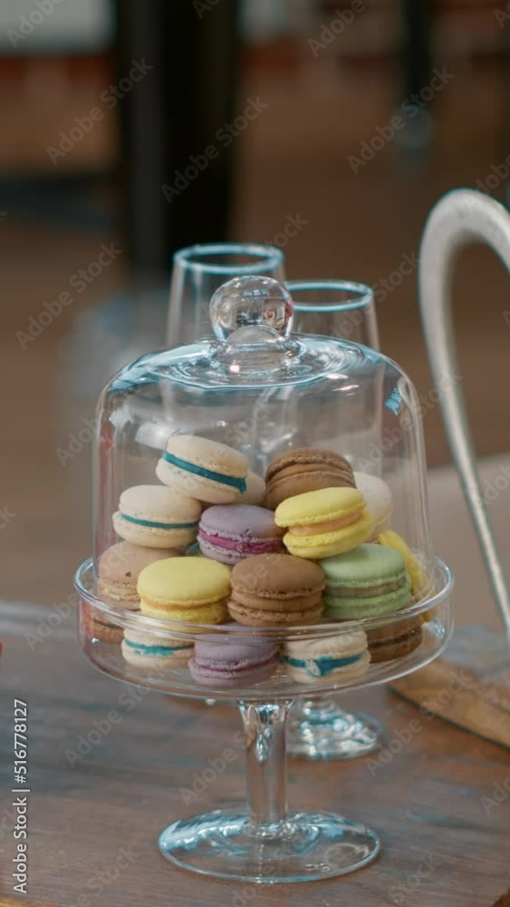 Vertical video: Nobody in space decorated with flowers bouquet and presents, sweet macarons and romantic gifts on table. Empty room with valentines day surprise and red roses to celebrate love holiday Vertical video: Nobody in space decorated with flowers bouquet and presents, sweet macarons and romantic gifts on table. Empty room with valentines day surprise and red roses to celebrate love holiday