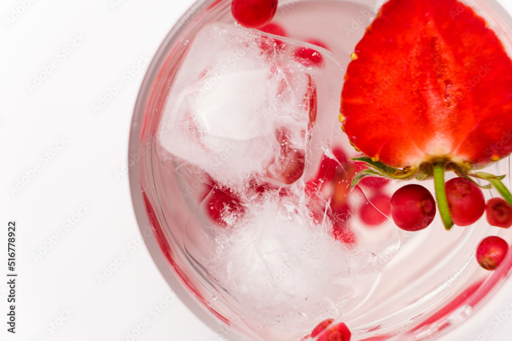 Summer refreshing cocktail with strawberries, berries and ice, top view, copy space. Summer refreshing cocktail with strawberries, berries and ice, top view, copy space.