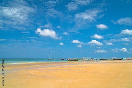 Fishing boats by the beach of the Andaman Sea - Phuket Island, Thailand