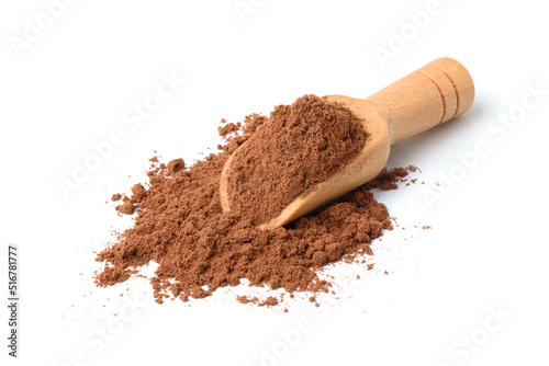 Cocoa powder with wooden scoop isolated on white background. photo