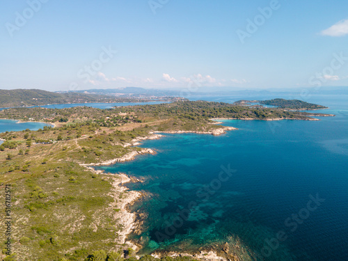 Aerial view of Diaporos Island in Halkidiki, Greece, Small islands with blue lagoon in the Aegean sea during summer holiday season