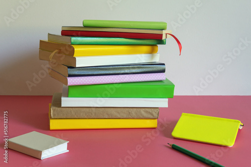 Stack of  different books on table. Copy space