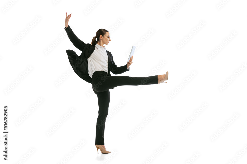 Young business woman wearing business style outfit in motion isolated on white background. Business, start-up, open-space, professional occupation concept.
