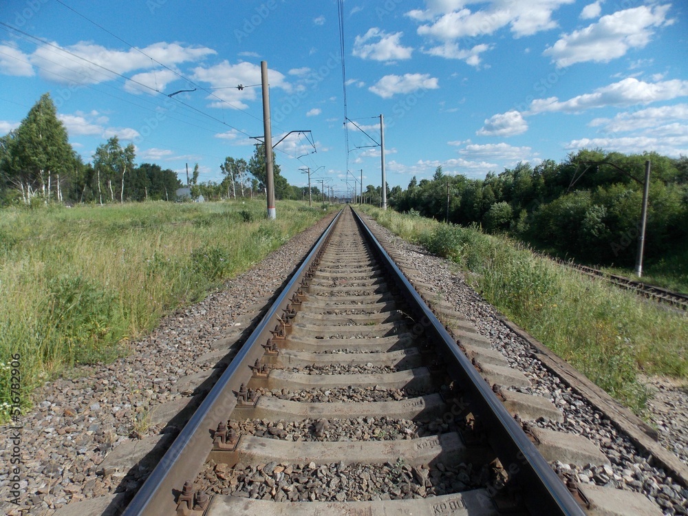 iron railroad tracks in the countryside