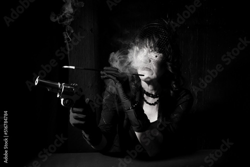 smoking woman with gun dramatic portrait from gangster era