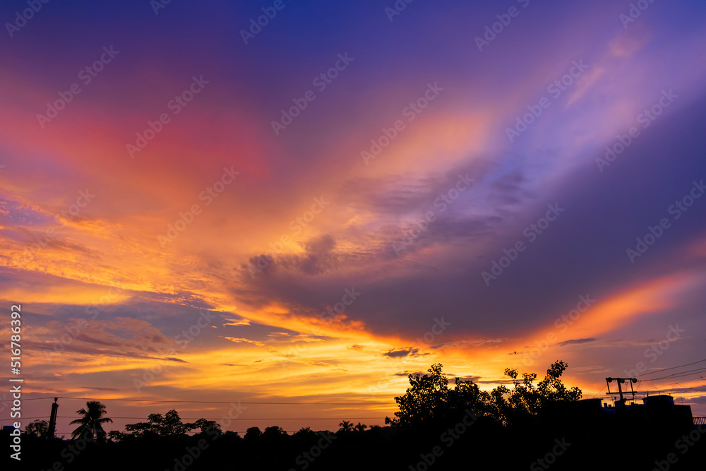 Dramatic colorful monsoon cloud formation in the sky during sunset