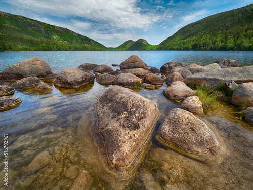 Jordan Pond in Acadia National Park, Maine with calm and transparent waters, on a sunny summer day. photo
