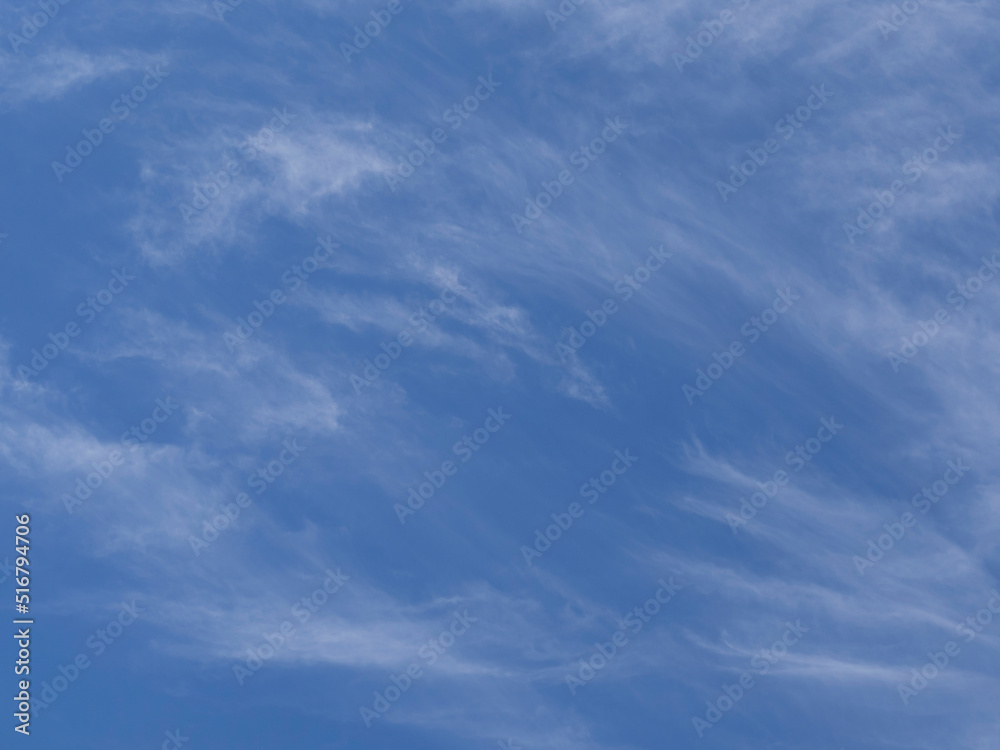 Soft wave clouds in the blue sky-the natural background of the sky