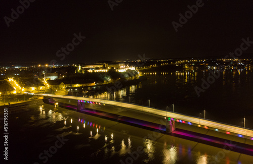 The capital of Vojvodina, Novi sad at night. The bridge on the Danube river. Aerial photography.