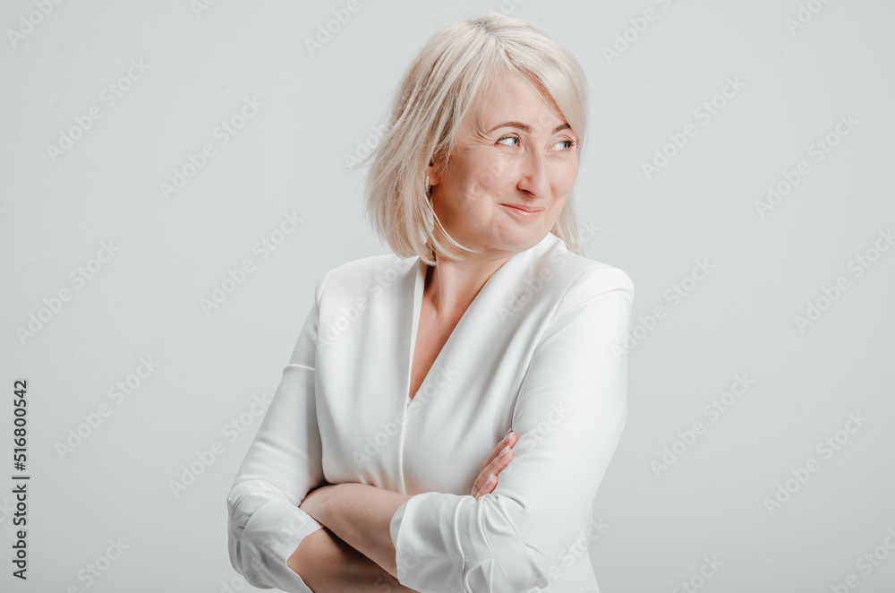 a woman in a white business suit on a white background