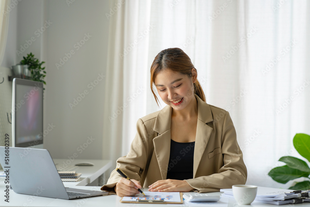 A beautiful Asian woman is working on collecting documents and information of the company's financial performance for the meeting. Account Analysis and Audit A beautiful Asian woman is working on collecting documents and information of the company's financial performance for the meeting. Account Analysis and Audit