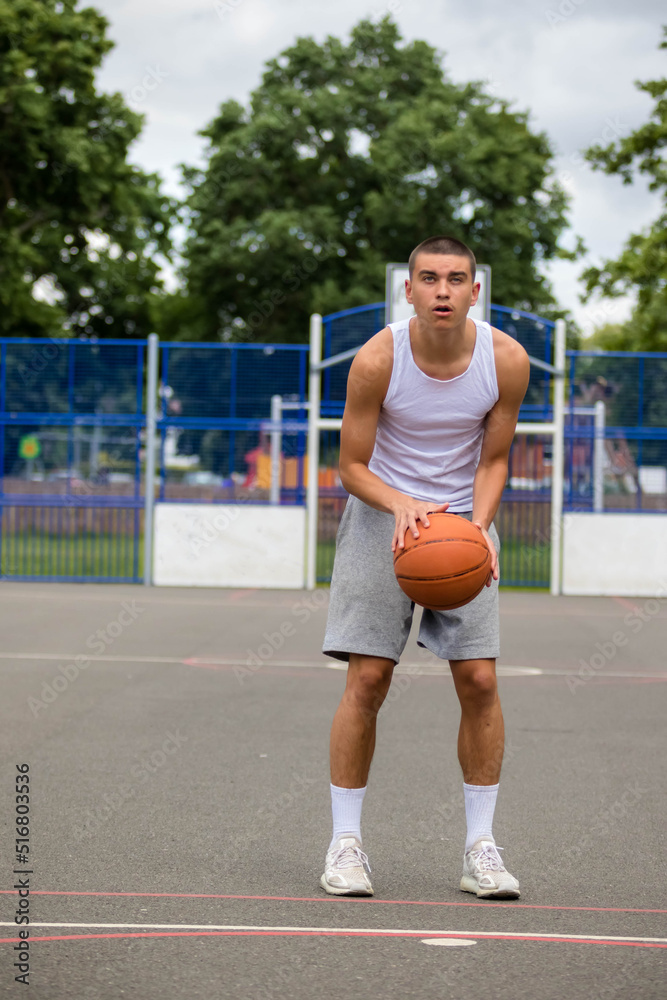 A Nineteen Year Old Teenage Boy Playing Basketball