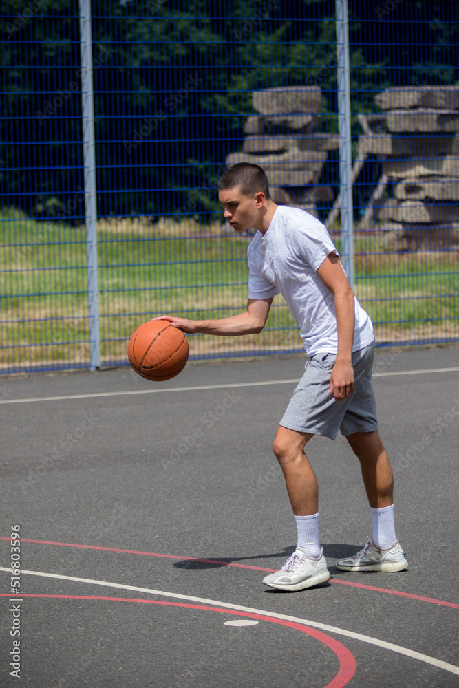 A Nineteen Year Old Teenage Boy Playing Basketball