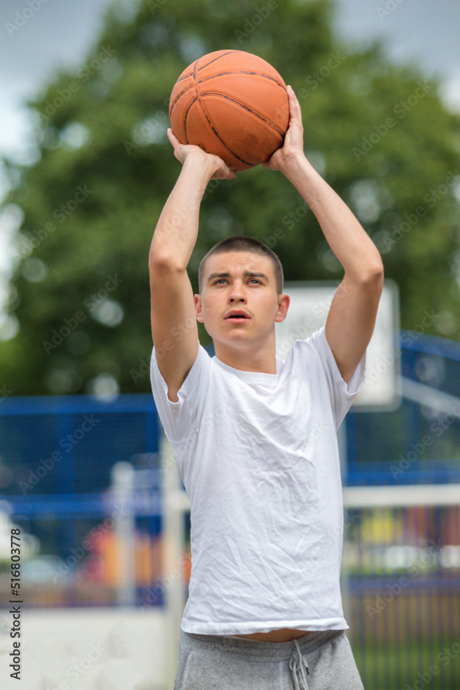 A Nineteen Year Old Teenage Boy Playing Basketball A Nineteen Year Old Teenage Boy Playing Basketball