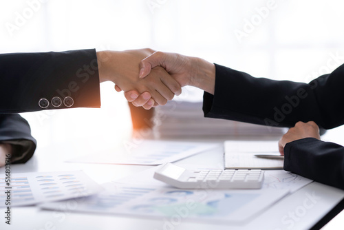crop shot of business woman handshake collaborates with partners to increase their business investment network for Plans to improve quality next month in their office. agreement concept.