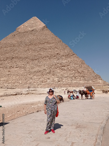 Caucasian tourist in front of a pyramid in Egypt