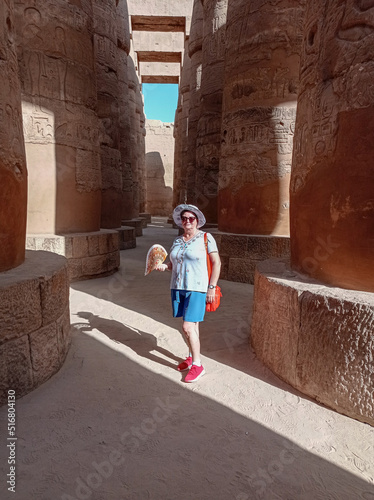 Caucasian tourist inside of an ancient egyptian temple