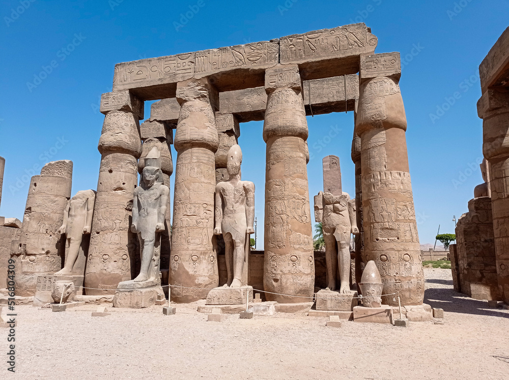 Ruins of an ancient egyptian temple with columns full of hieroglyphs in Egypt