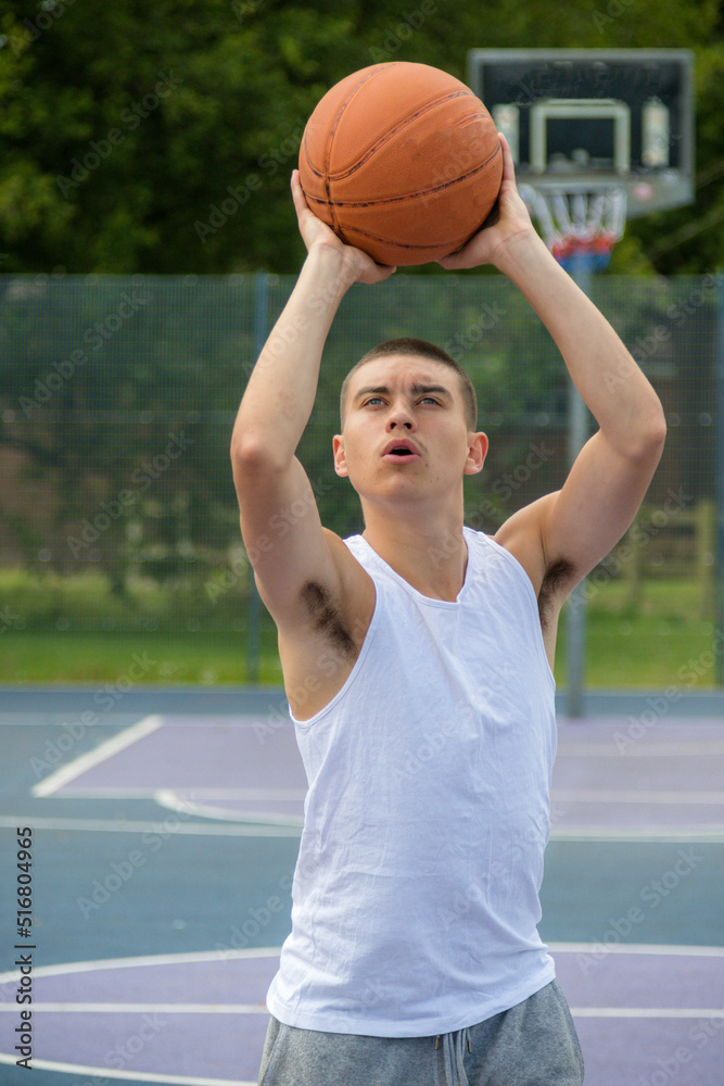 A Nineteen Year Old Teenage Boy Playing Basketball