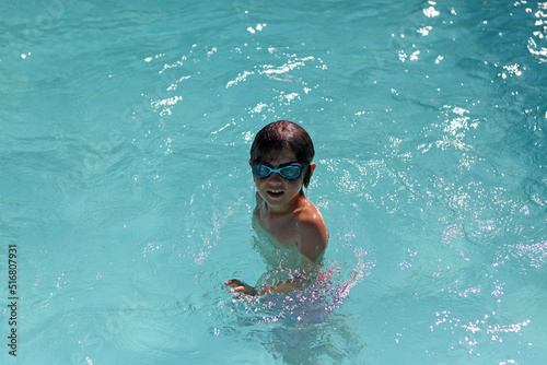 Boy enjoying in a swimming pool