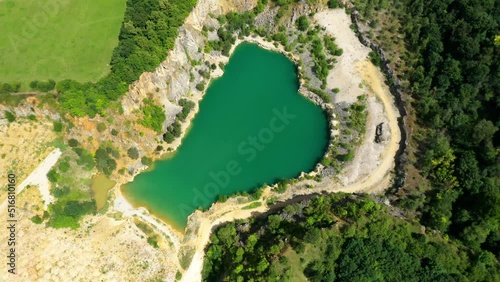 Aerial view of the abandoned Homolak quarry with a clear lake at the bottom. A popular holiday destination in the Czech Karst. Central Bohemia, Czech Republic photo